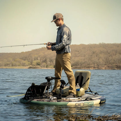Angler standing and fishing from a GoBoat Fish inflatable electric boat on a lake