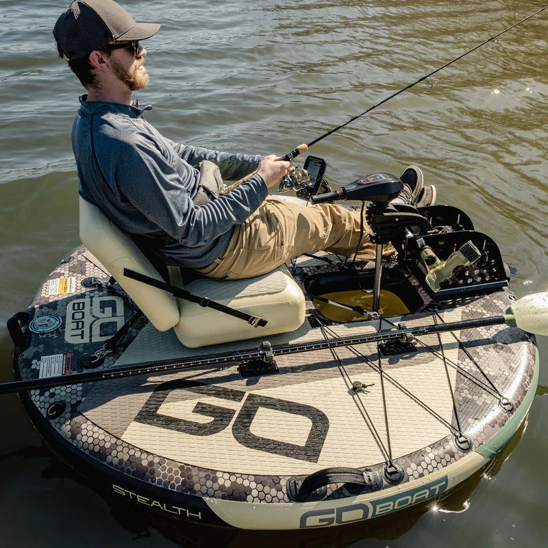Angler seated and fishing from a GoBoat Fish inflatable electric boat on the water