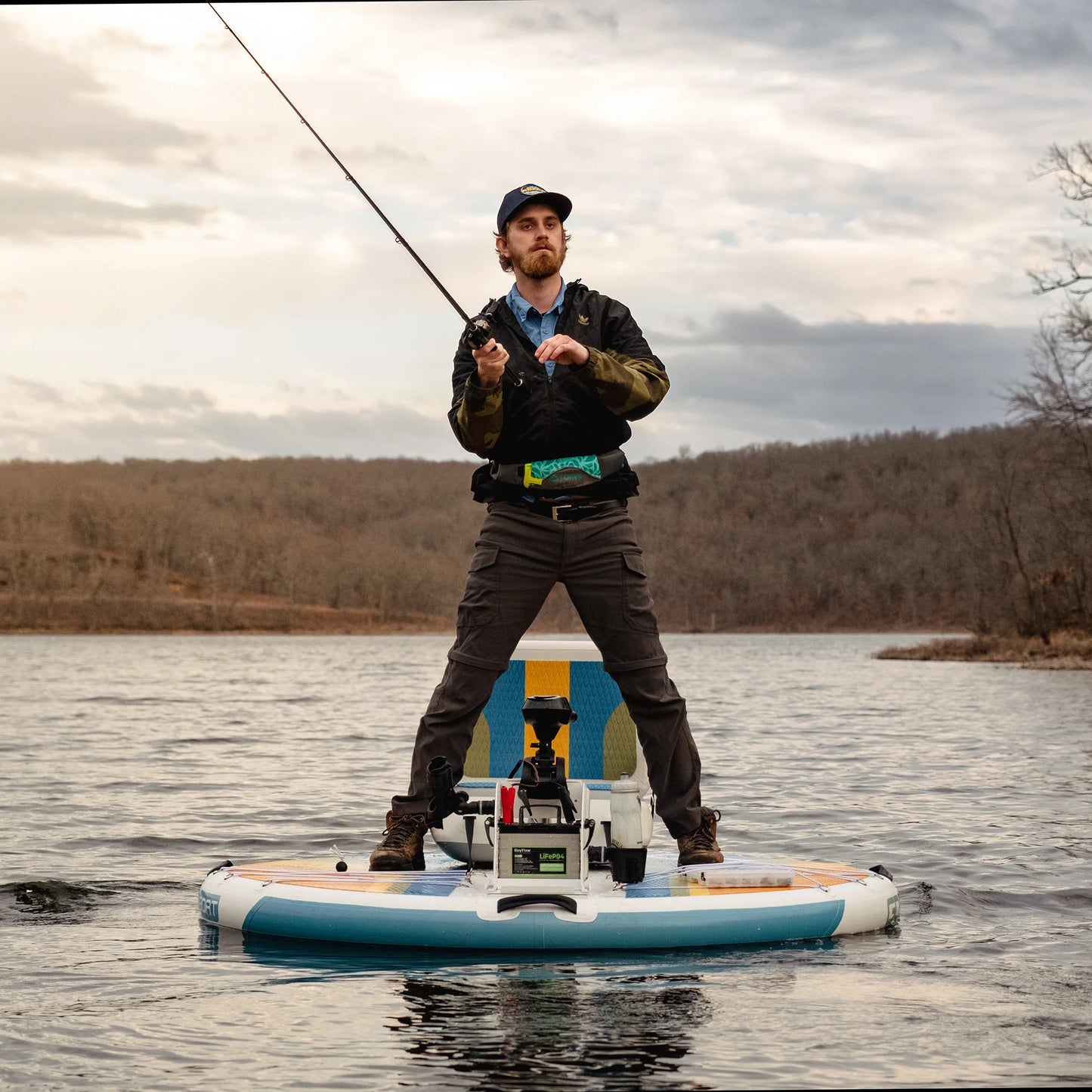 GoBoat Fish inflatable electric boat — angler standing and casting on a lake