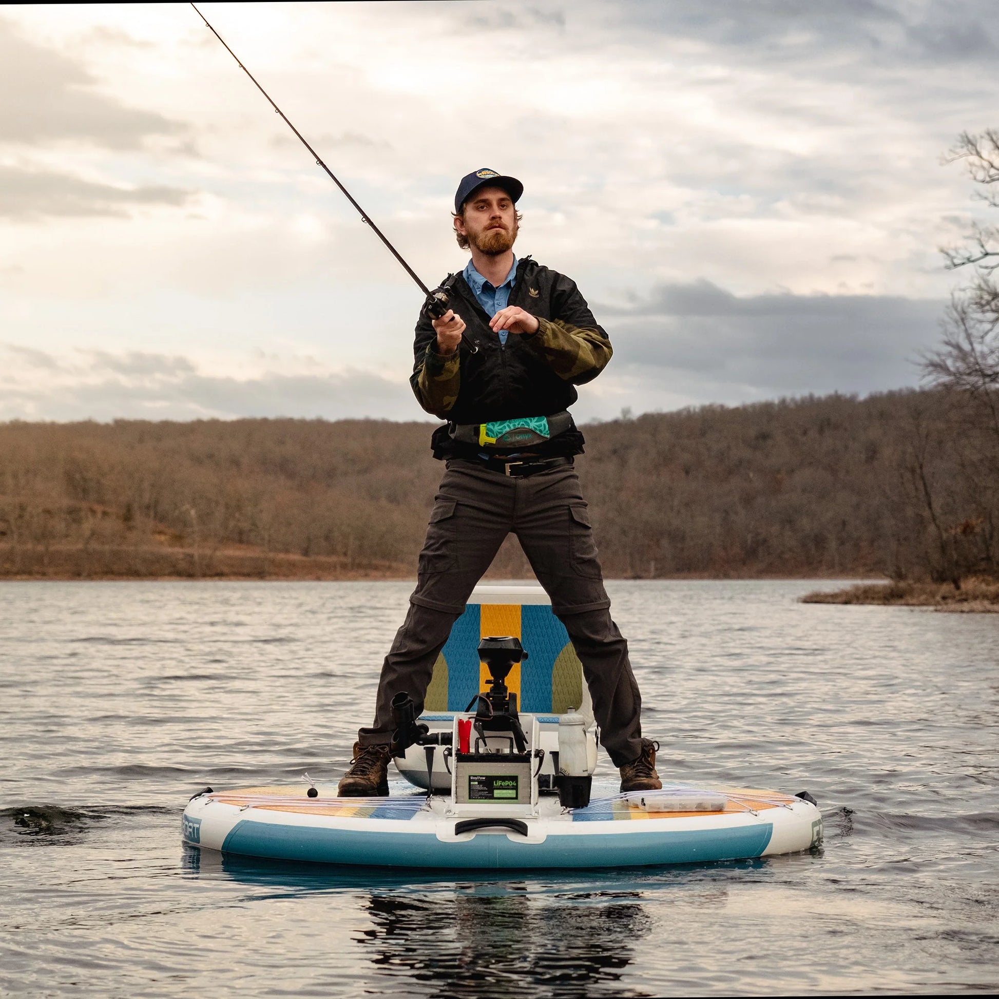 GoBoat Fish inflatable electric boat — angler standing and casting on a lake